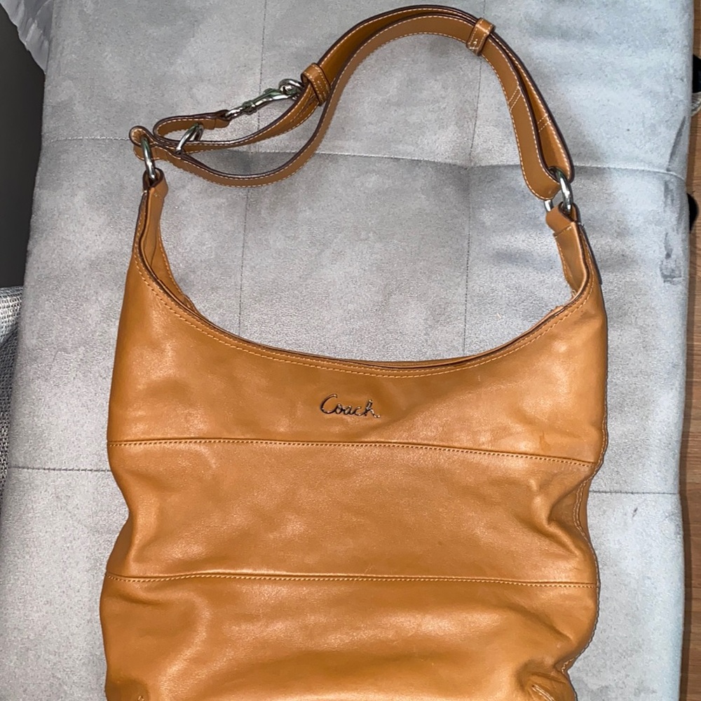 Tan colored coach purse